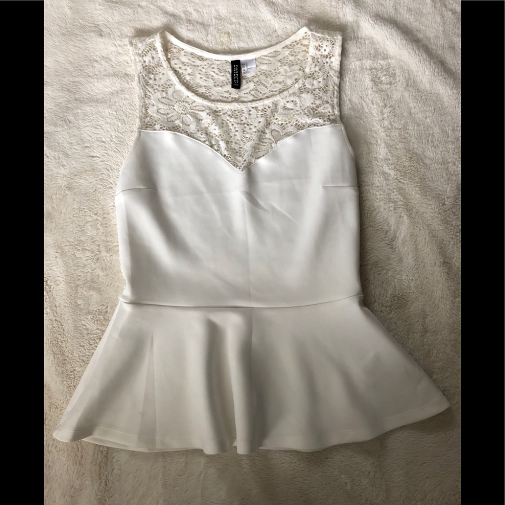 White fit and flare top with lace back.